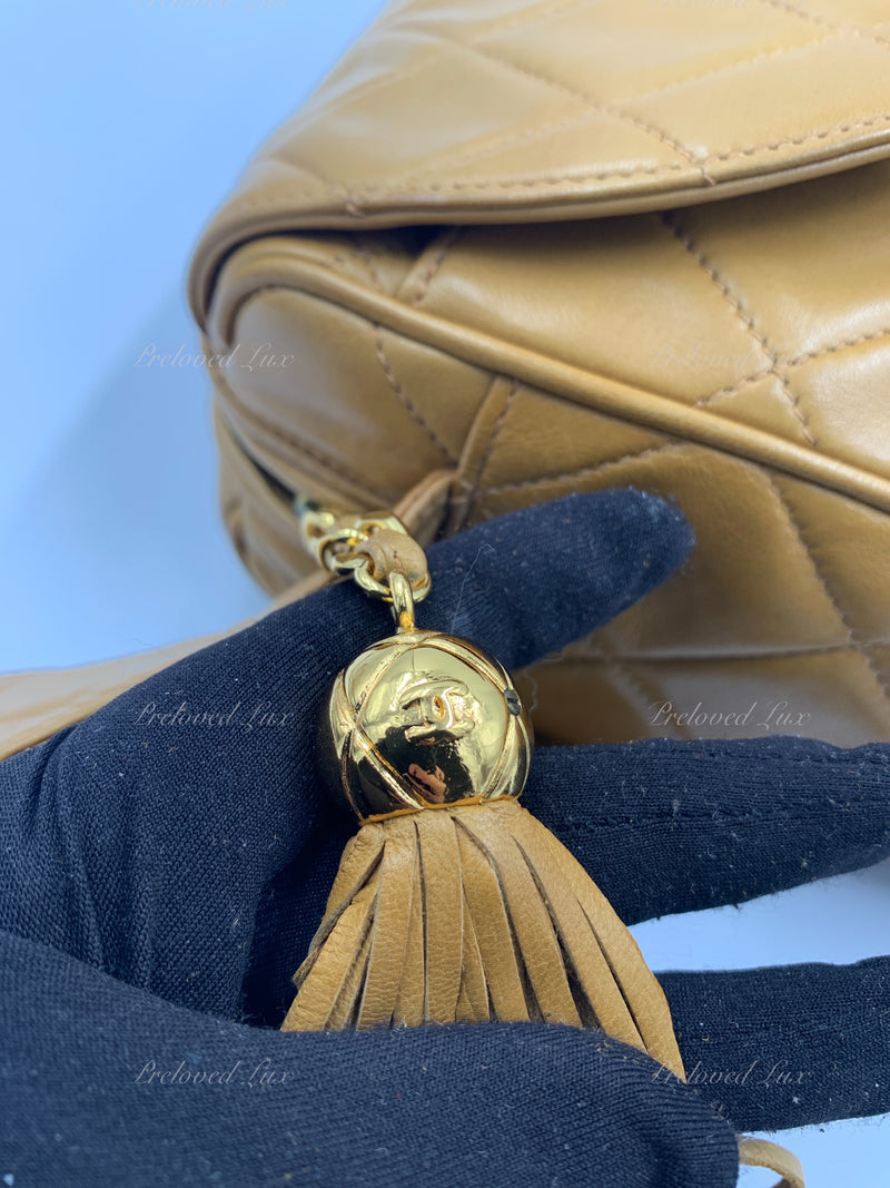 CHANEL Lambskin Camel (Dark Beige) Large Camera Bag with Tassel - Preowned  Chanel Canada Luxury consignment – Preloved Lux